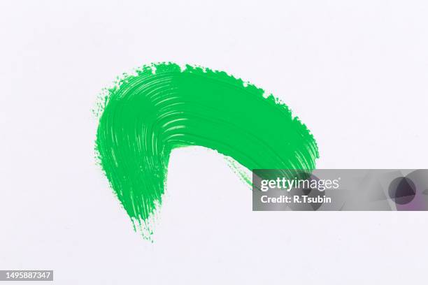 green texture splash stroke of the paint brush on white paper background - estonia school stock pictures, royalty-free photos & images