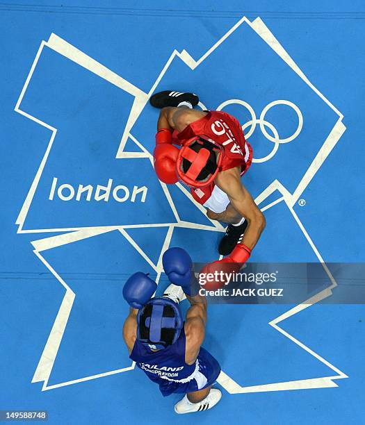 Mohamed Flissi of Alergia and Kaeo Pongprayoon of Thailand battle during their first round Light Flyweight boxing match of the London 2012 Olympics...