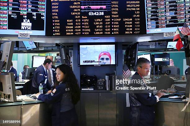 Traders work on the floor of the New York Stock Exchange at the end of the trading day on July 31, 2012 in New York City. As meetings by the U.S. And...