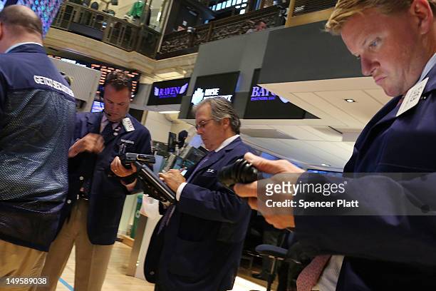 Traders work on the floor of the New York Stock Exchange at the end of the trading day on July 31, 2012 in New York City. As meetings by the U.S. And...