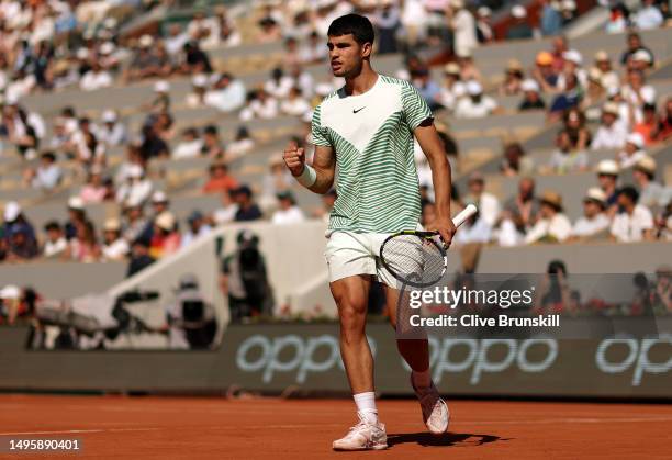 Carlos Alcaraz of Spain celebrates a point against Lorenzo Musetti of Italy during the Men's Singles Fourth Round match on Day Eight of the 2023...