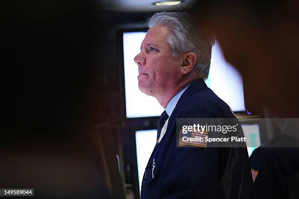 Trader works on the floor of the New York Stock Exchange at the end of the trading day at the end of the trading day on July 31, 2012 in New York...