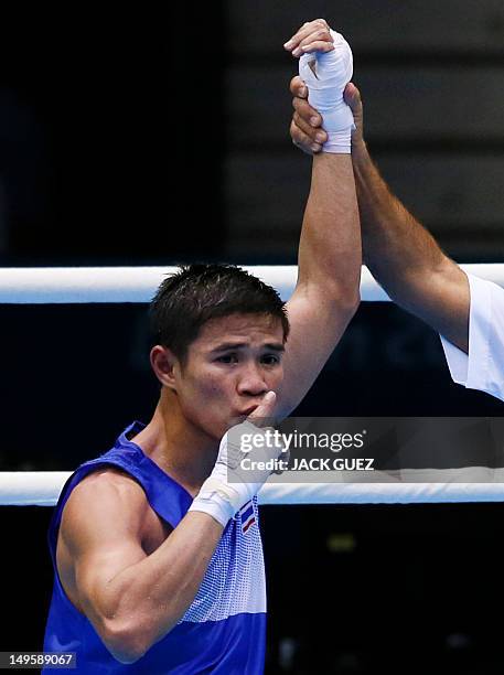 Kaeo Pongprayoon of Thailand is declared winner over Mohamed Flissi of Alergia in their first round Light Flyweight boxing match of the London 2012...