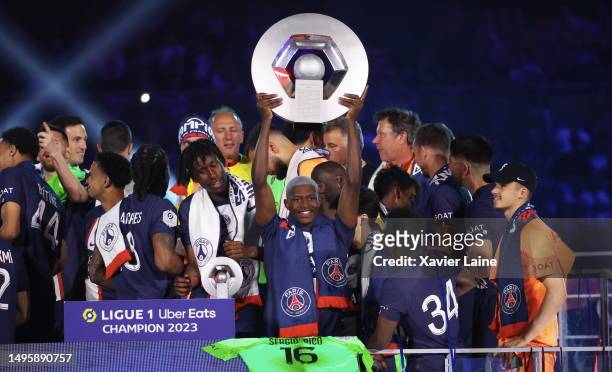 Nuno Mendes of Paris Saint-Germain celebrate the championship trophy after the Ligue 1 match between Paris Saint-Germain and Clermont Foot at Parc...