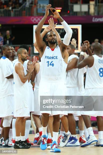 Ronny Turiaf of France and team mates celebrate winning the Men's Basketball Preliminary Round match between France and Argentina on Day 4 of the...