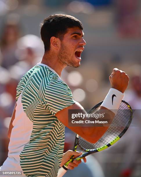 Carlos Alcaraz of Spain celebrates a point against Lorenzo Musetti of Italy during the Men's Singles Fourth Round match on Day Eight of the 2023...