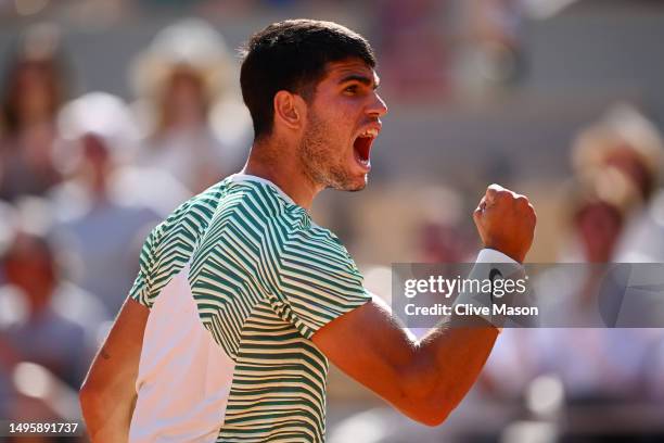Carlos Alcaraz of Spain celebrates a point against Lorenzo Musetti of Italy during the Men's Singles Fourth Round match on Day Eight of the 2023...