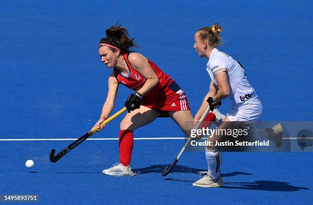 Laura Unsworth of Great Britain is tackled by Charlotte Englebert of Belgium during FIH Hockey Pro League Women's match between Great Britain and...