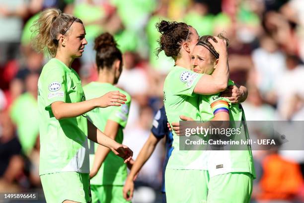 Svenja Huth of VfL Wolfsburg is embraced after the UEFA Women's Champions League final match between FC Barcelona and VfL Wolfsburg at PSV Stadion on...