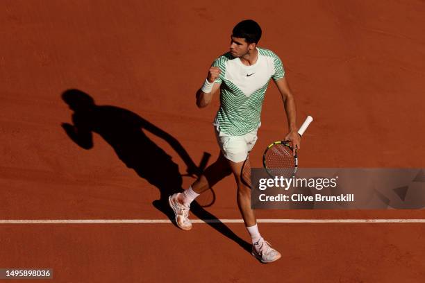 Carlos Alcaraz of Spain celebrates a point against Lorenzo Musetti of Italy during the Men's Singles Fourth Round match on Day Eight of the 2023...