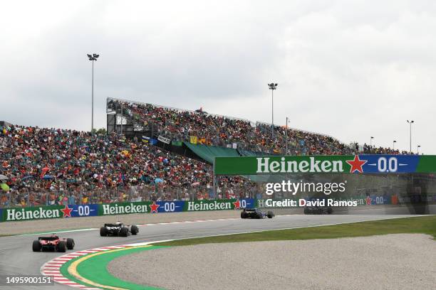 Kevin Magnussen of Denmark driving the Haas F1 VF-23 Ferrari leads Pierre Gasly of France driving the Alpine F1 A523 Renault on track during the F1...