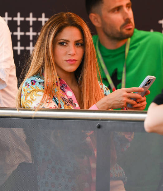 Shakira texts on his mobile phone as she watches the action during the F1 Grand Prix of Spain at Circuit de Barcelona-Catalunya on June 04, 2023 in...