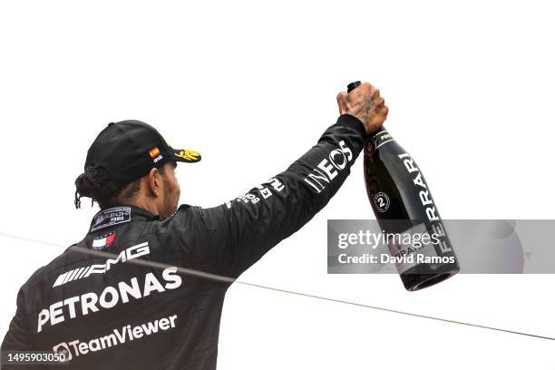 Second placed Lewis Hamilton of Great Britain and Mercedes driving the Mercedes AMG Petronas F1 Team W14 celebrates on the podium during the F1 Grand...