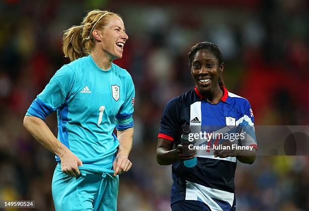 Karen Bardsley of Great Britain and Anita Asante of Great Britain celebrate their team's victory after the Women's Football first round Group E Match...