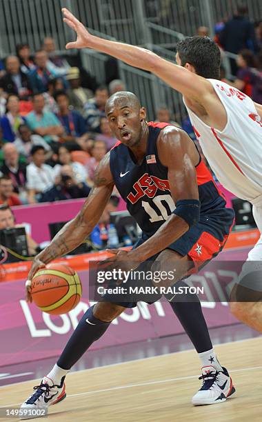 Guard Kobe Bryant dribbles during the Men's preliminary round group A basketball match of the London 2012 Olympic Games Tunisia vs USA on July 31,...