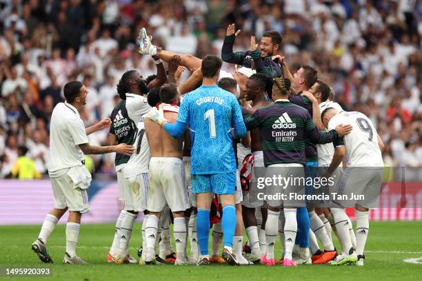 Eden Hazard of Real Madrid is thrown in the air by teammates following the LaLiga Santander match between Real Madrid CF and Athletic Club at Estadio...