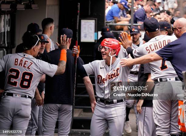 Spencer Torkelson of the Detroit Tigers is congratulated by teammates following a two-run home run against the Chicago White Sox at Guaranteed Rate...