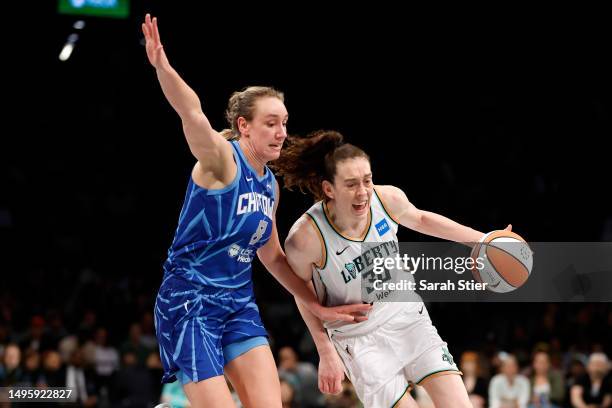 Breanna Stewart of the New York Liberty dribbles against Alanna Smith of the Chicago Sky during the first half at Barclays Center on June 04, 2023 in...