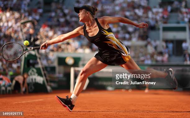 Elina Svitolina of Ukraine stretches for a backhand in her match against Daria Kasatkina during the Women's Singles Fourth Round match on Day Eight...