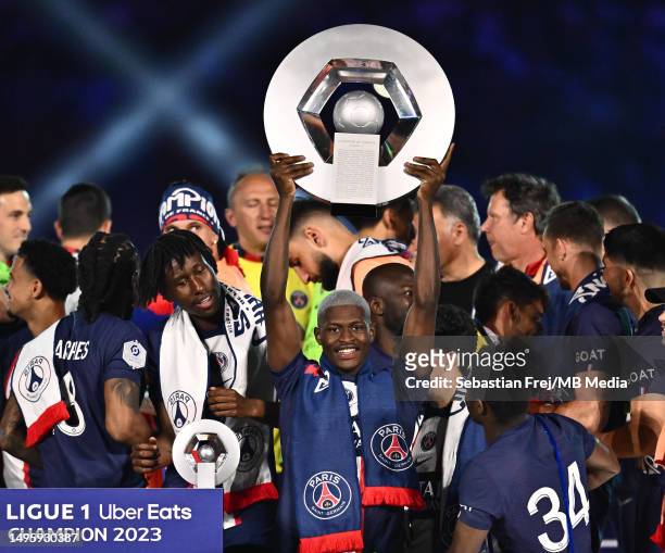 Nuno Mendes of Paris Saint-Germain celebrate with Ligue 1 trophy during the Ligue 1 match between Paris Saint-Germain and Clermont Foot at Parc des...