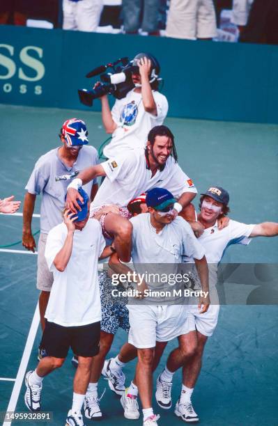 Chestnut Hill, USA Patrick Rafter on the shoulders of Lleyton Hewitt and the rest of the Australia team celebrate Rafters win over Jim Courier of the...