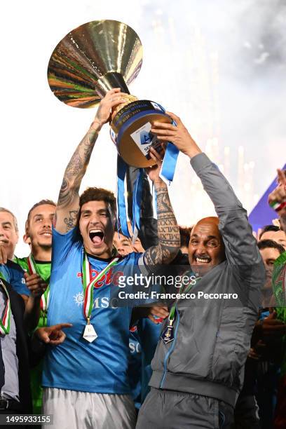 Luciano Spalletti, Head Coach of SSC Napoli, and Giovanni Di Lorenzo of SSC Napoli celebrate with the Serie A trophy following the Serie A match...