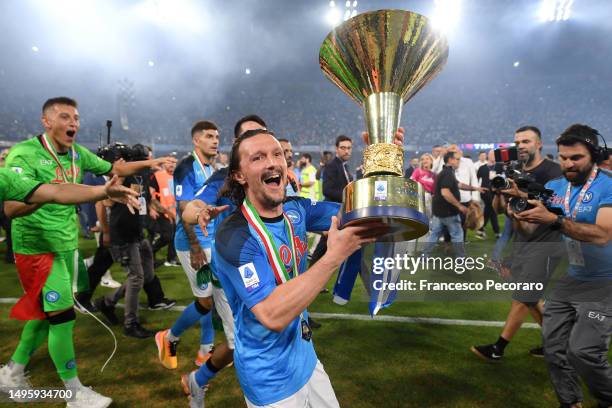 Mario Rui of SSC Napoli celebrates with the Serie A trophy following the Serie A match between SSC Napoli and UC Sampdoria at Stadio Diego Armando...
