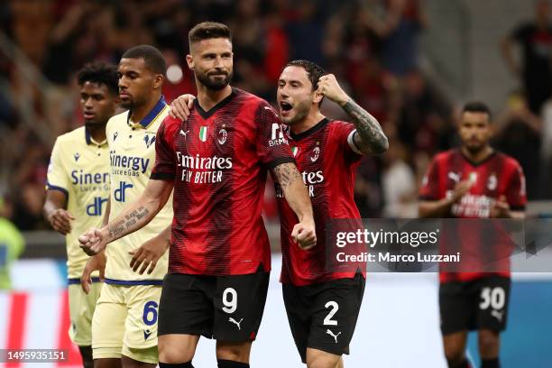 Milan, ITALY Olivier Giroud of AC Milan celebrates with team mate Davide Calabria after scoring their sides first goal from the penalty spot during...