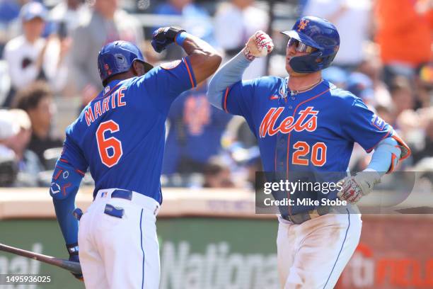 Pete Alonso of the New York Mets celebrates with Starling Marte after hitting a homerun in the sixth inning against the Toronto Blue Jays at Citi...