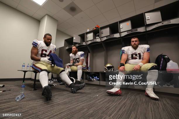 Joshua Dunlop, Sean Pollard and Noah Johnson of the Michigan Panthers in the locker room prior to a game against the New Orleans Breakers at...