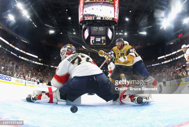 Jonathan Marchessault of the Vegas Golden Knights watches the game winning shot by Zach Whitecloud get past Sergei Bobrovsky of the Florida Panthers...