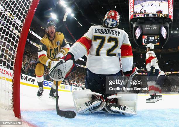 Jonathan Marchessault of the Vegas Golden Knights watches the game winning shot by Zach Whitecloud get past Sergei Bobrovsky of the Florida Panthers...