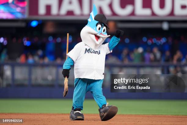 Miami Marlins mascot Billy the Marlin walks with a broom on the field after the Miami Marlins defeated the Oakland Athletics and swept the series at...