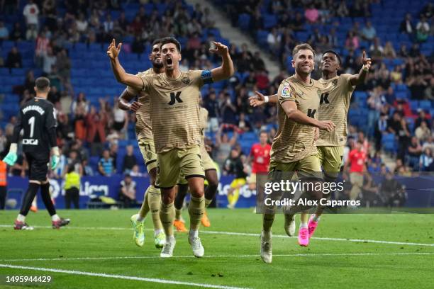 Adri Embarba of UD Almeria celebrates with teammates after scoring the team's third goal from a penalty kick during the LaLiga Santander match...