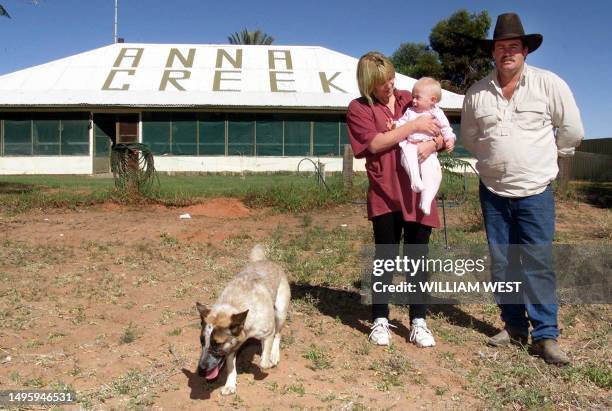 Manager of the Anna Creek cattle station, Grant McSporrin , poses outside the original station homestead with his wife Tracey and daughter Kaitlin on...