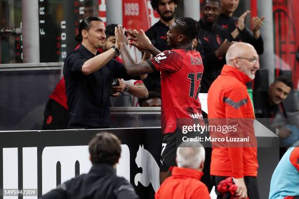 Rafael Leao of AC Milan celebrates with team mate Zlatan Ibrahimovic after scoring their sides second goal during the Serie A match between AC MIlan...