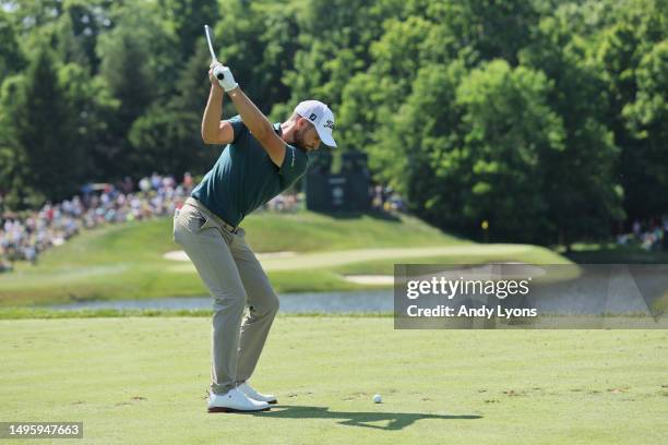 Wyndham Clark of the United States hits a tee shot on the 12th hole during the final round of the Memorial Tournament presented by Workday at...