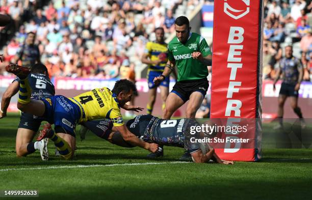 Hull FC player Danny Houghton dives over to score the first Hull try during the Betfred Super League Magic Weekend match between Hull FC and...
