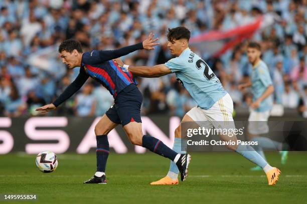 Andreas Christensen of FC Barcelona is challenged by Gabri Veiga of RC Celta during the LaLiga Santander match between RC Celta and FC Barcelona at...