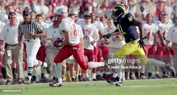 Washington State Wide Receiver Chris Jackson game action as Michigans Cornerback Tommy Hendricks moves in for tackle during Rose Bowl game of...