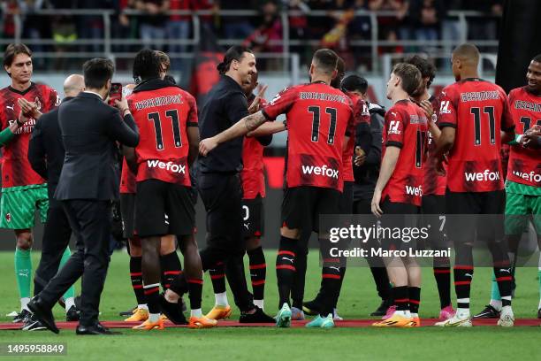 Zlatan Ibrahimovic of AC Milan walks through an AC Milan players guard of honour after the Serie A match between AC MIlan and Hellas Verona at Stadio...