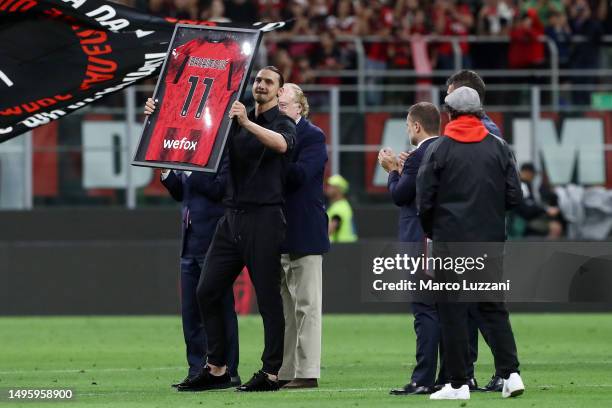 Zlatan Ibrahimovic of AC Milan is presented with his framed AC Milan shirt after the Serie A match between AC MIlan and Hellas Verona at Stadio...