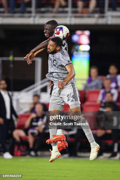 Christian Benteke of D.C. United and George Campbell of CF Montréal compete for the ball during the second half of the MLS game at Audi Field on May...