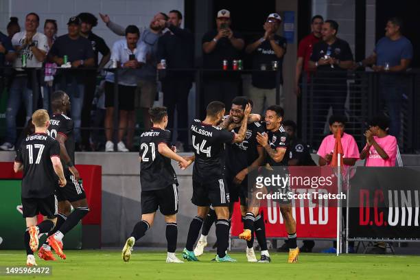 Donovan Pines of D.C. United celebrates with teammates after scoring a goal against the CF Montréal during the first half of the MLS game at Audi...