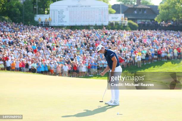 Viktor Hovland of Norway reacts after a making a putt to win in a playoff on the 18th green during the final round of the Memorial Tournament...