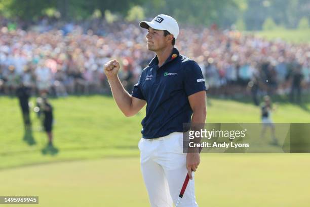 Viktor Hovland of Norway reacts after a making a putt to win in a playoff on the 18th green during the final round of the Memorial Tournament...