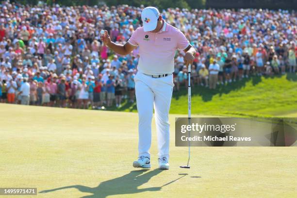 Si Woo Kim of South Korea reacts to a putt on the 18th green during the final round of the Memorial Tournament presented by Workday at Muirfield...