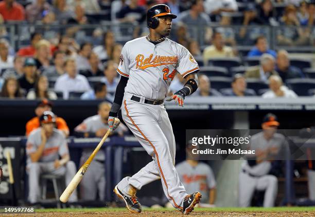 Wilson Betemit of the Baltimore Orioles follows through on a fifth inning RBI single against the New York Yankees at Yankee Stadium on July 31, 2012...