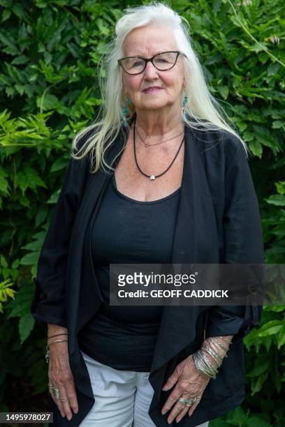 Aneira Thomas poses for a picture in her garden in Swansea on the south coast of Wales on July 3, 2023. Aneira Thomas holds the honour of being the...