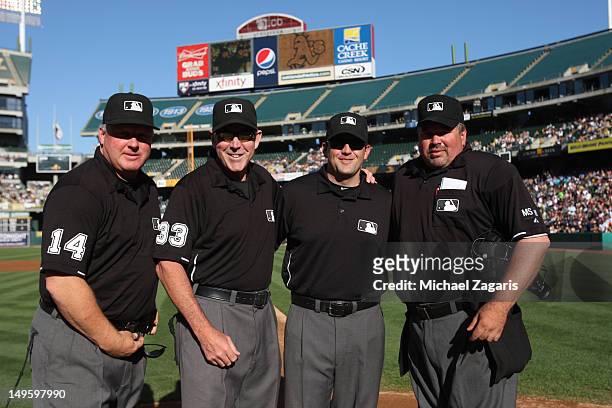 Umpires Bill Miller, Brian Knight, and Wally Bell honor Mike Winters on umpiring his 3000 game prior to the game between the New York Yankees and the...